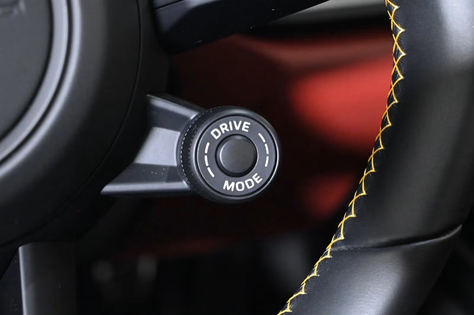 Drive mode dial on steering wheel