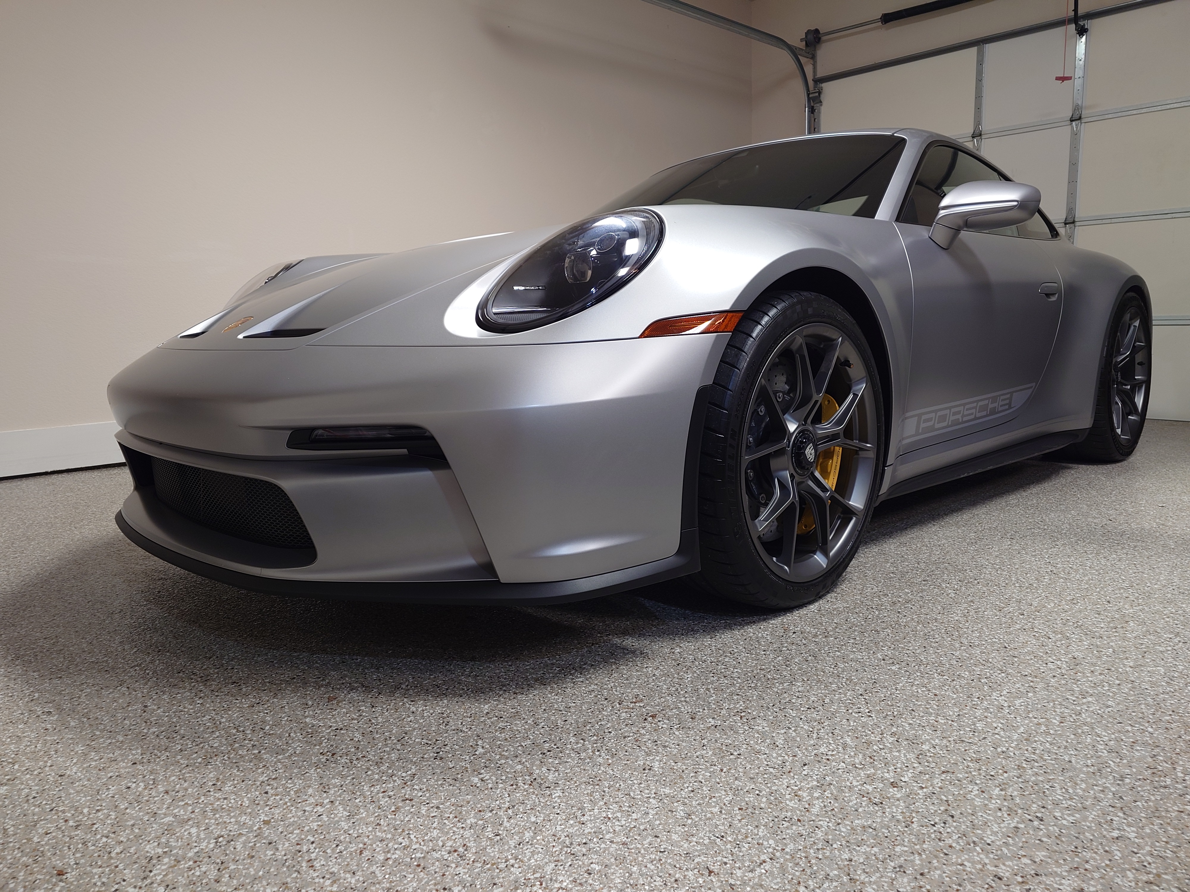 Front three-quarter, garage, satin PPF finish visible