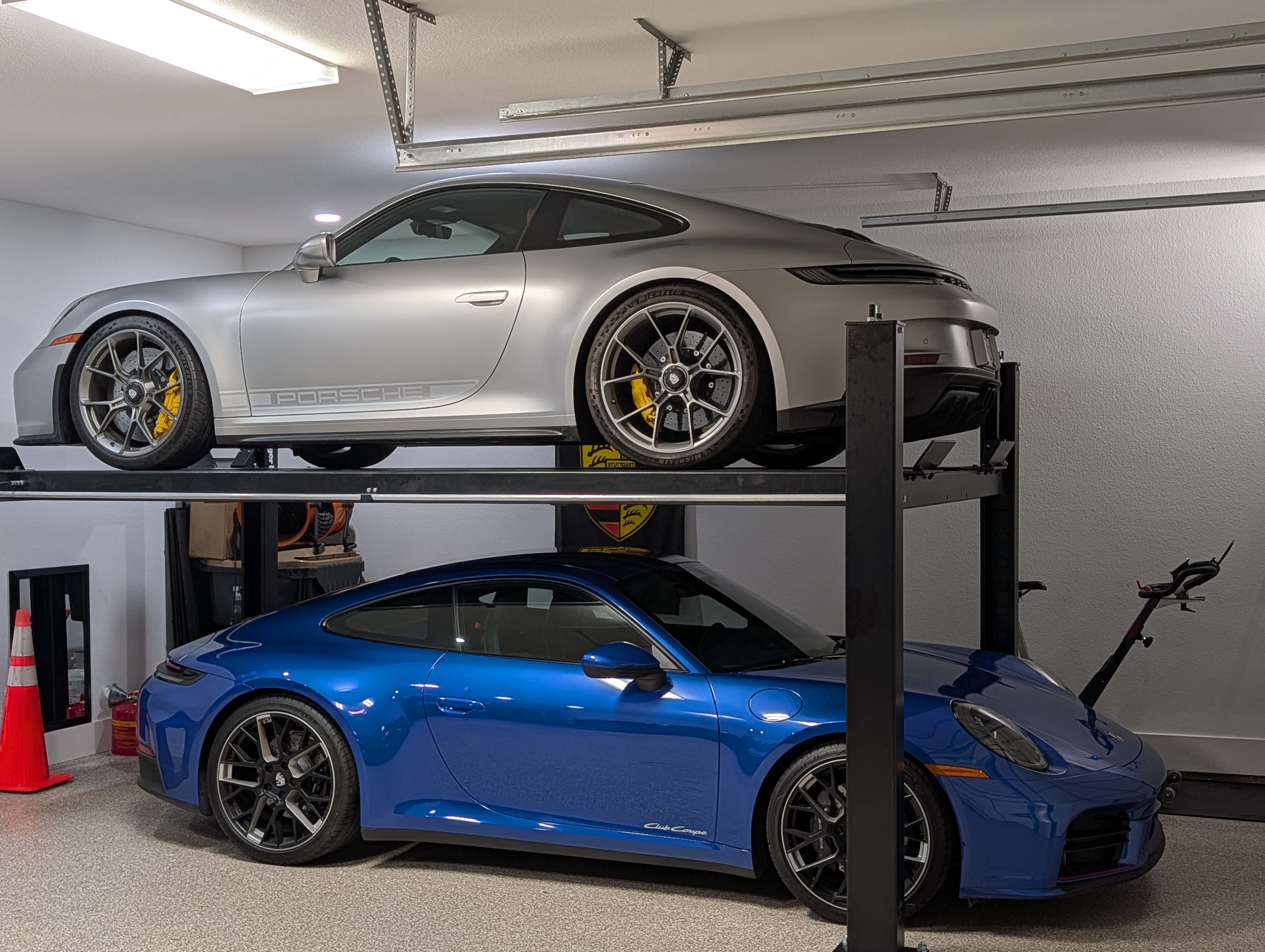 On a four-post lift in the garage