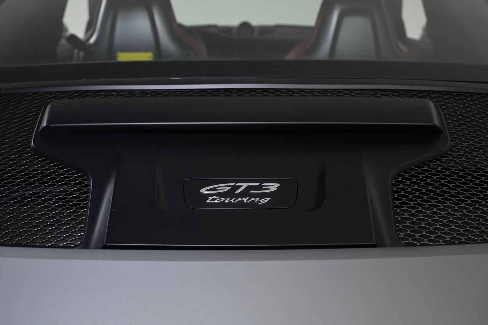 GT3 Touring badge on rear deck panel, close-up
