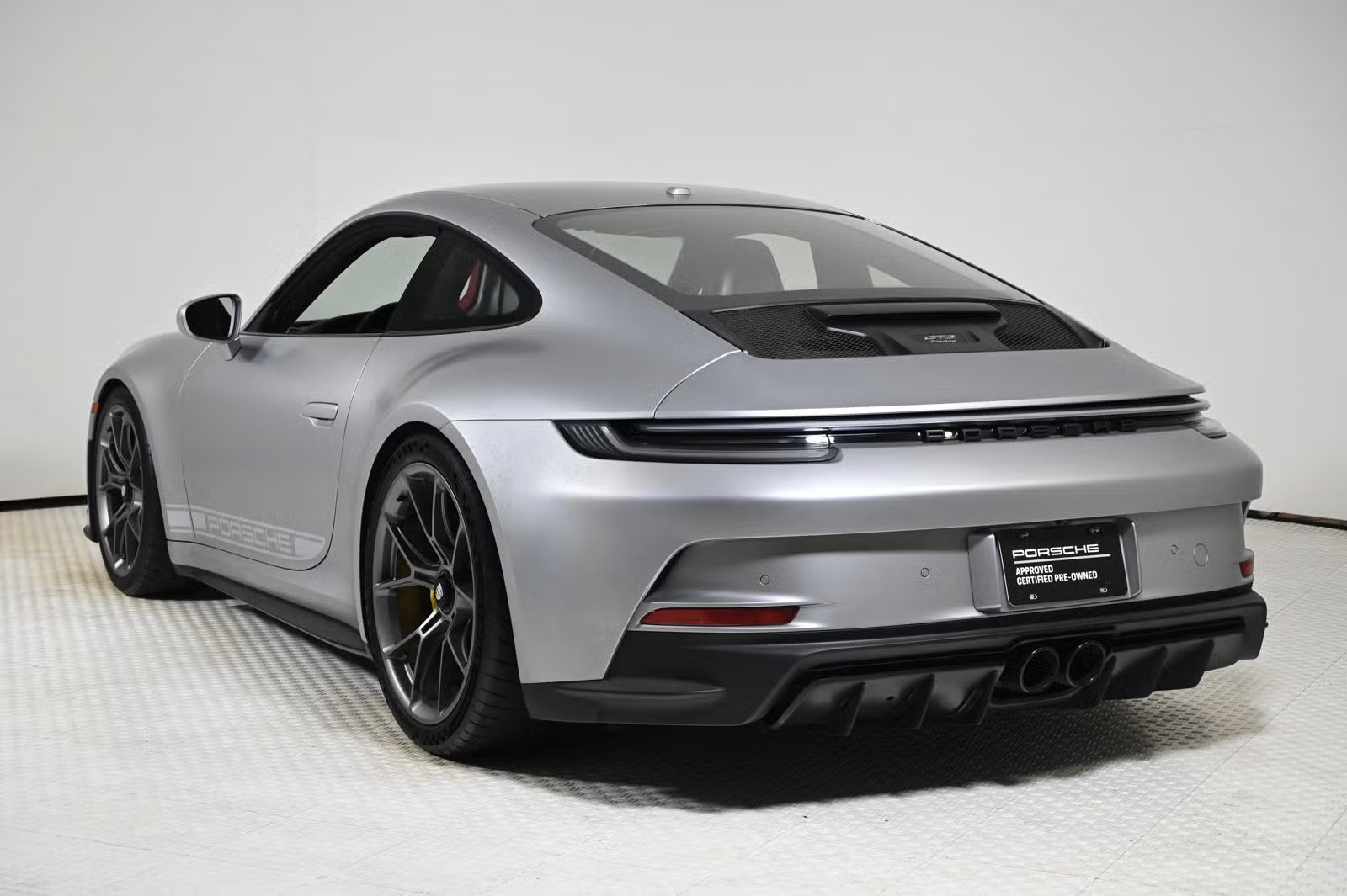 Rear three-quarter view showing wingless Touring deck