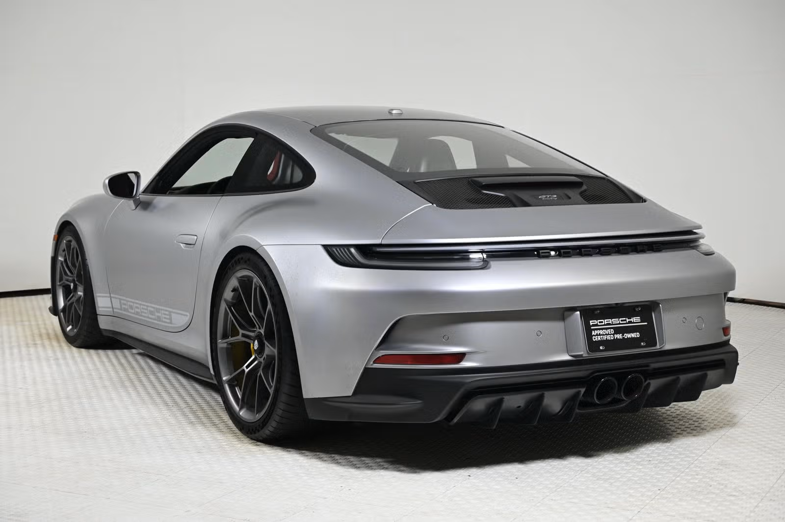 Rear three-quarter view showing wingless Touring deck