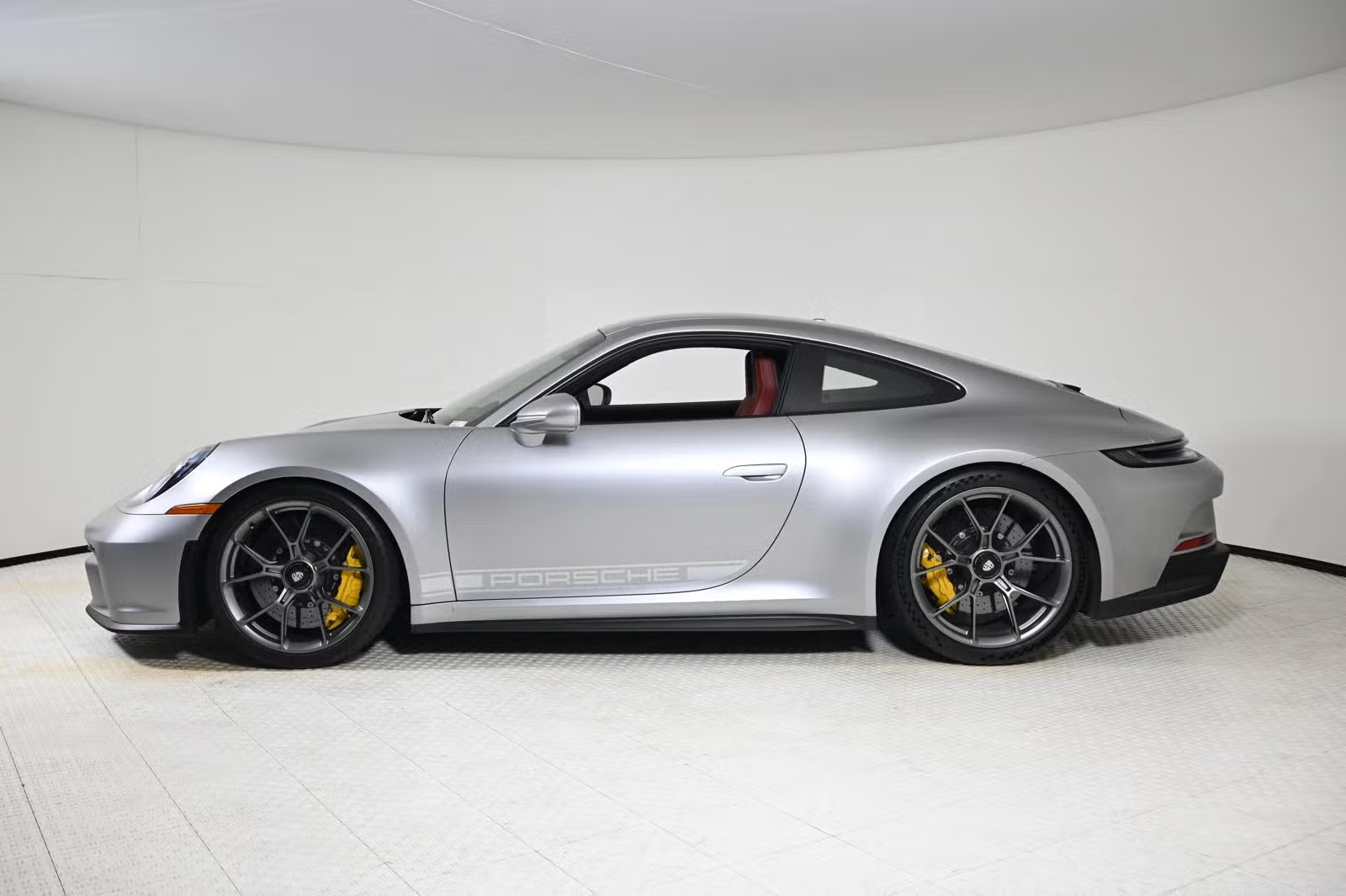 Side profile showing satin dark silver wheels and yellow PCCB calipers