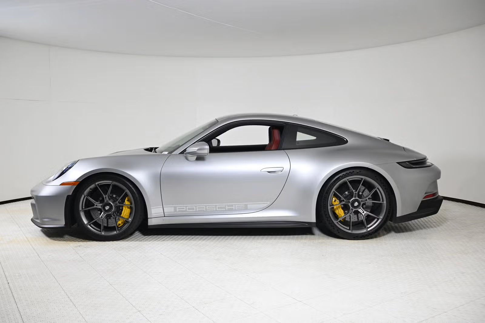 Side profile showing satin dark silver wheels and yellow PCCB calipers